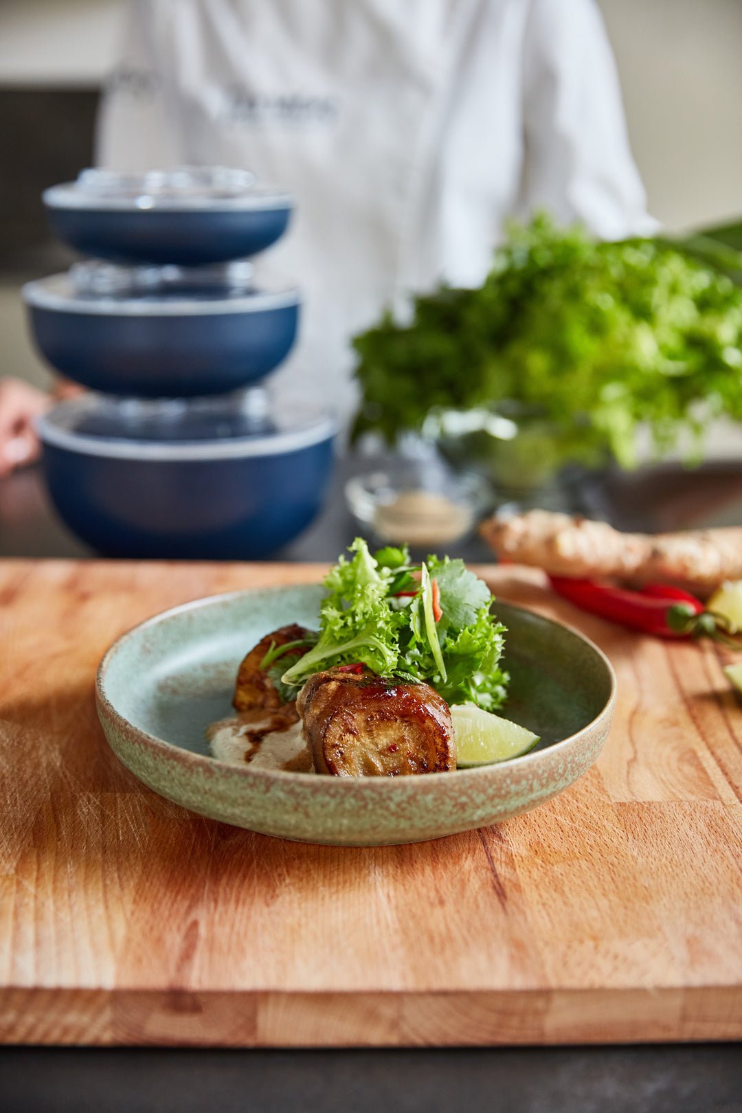 glazed eggplant cubes with sesame and lime sauce, served with aromatic salad and yogurt dressing.
