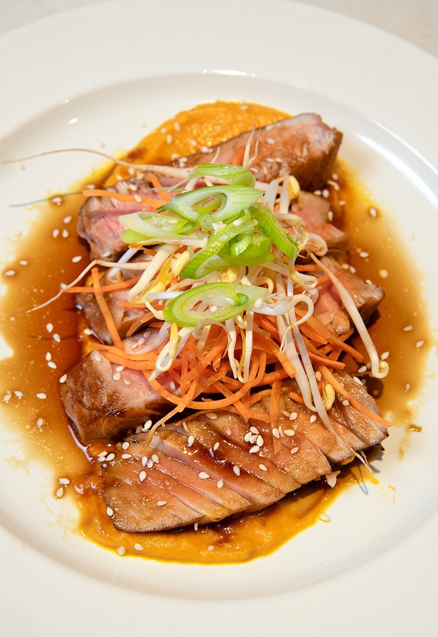 teriyaki marinated tataki tuna with roasted carrot purée.